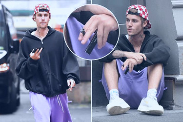 Justin Bieber looks stressed as he's caught smoking while alone on NYC  sidewalk in bizarre new pics without wife Hailey | The US Sun